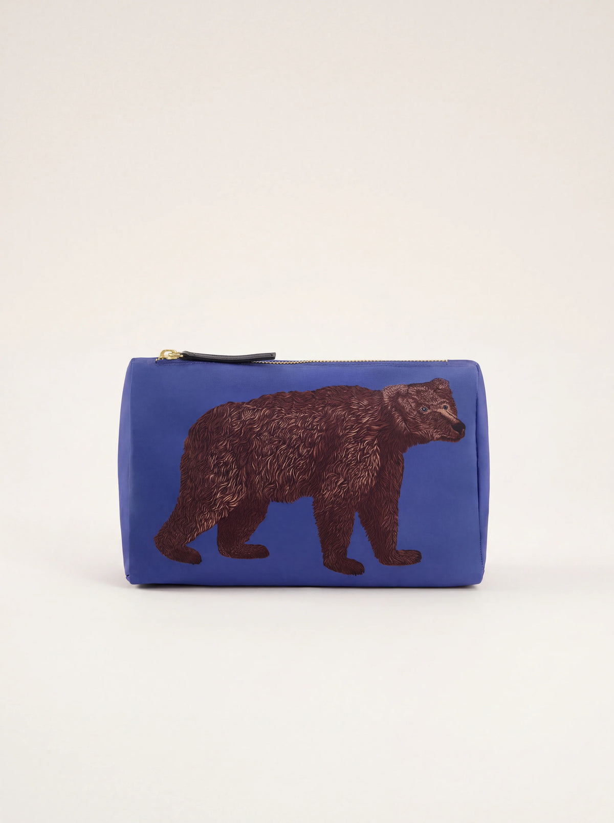 Blue fabric pouch with a printed brown bear illustration and zip top