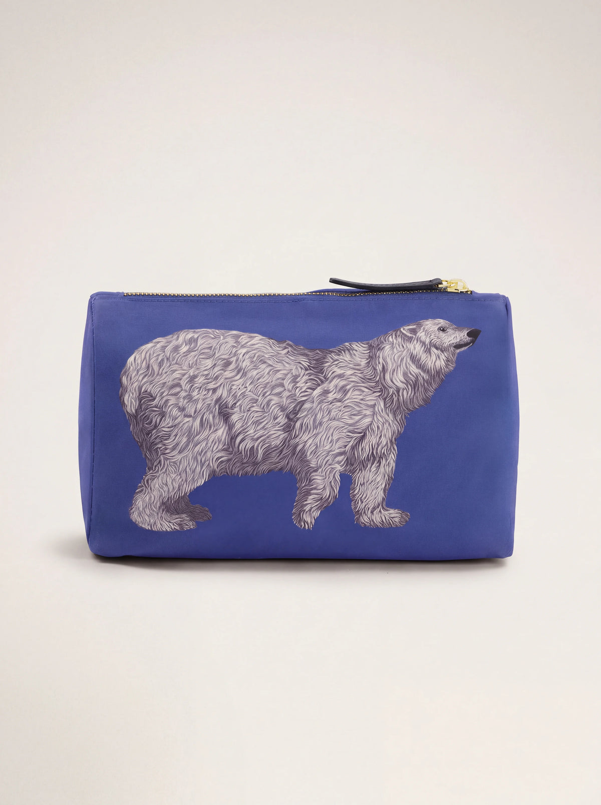 Reverse side of the blue pouch featuring a printed polar bear illustration
