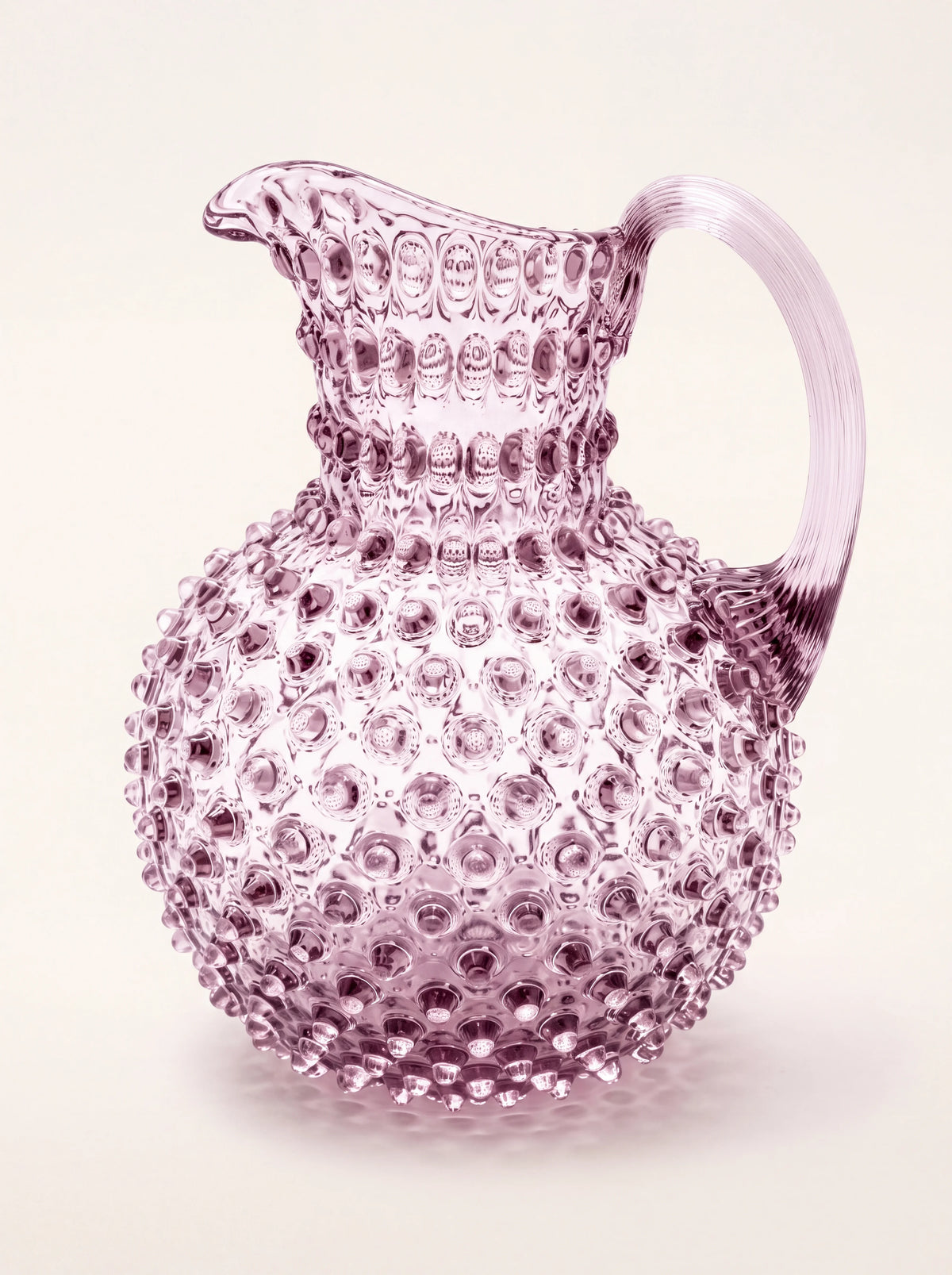 Amethyst glass jug with an all-over hobnail texture, bulbous body, flared spout and arched handle