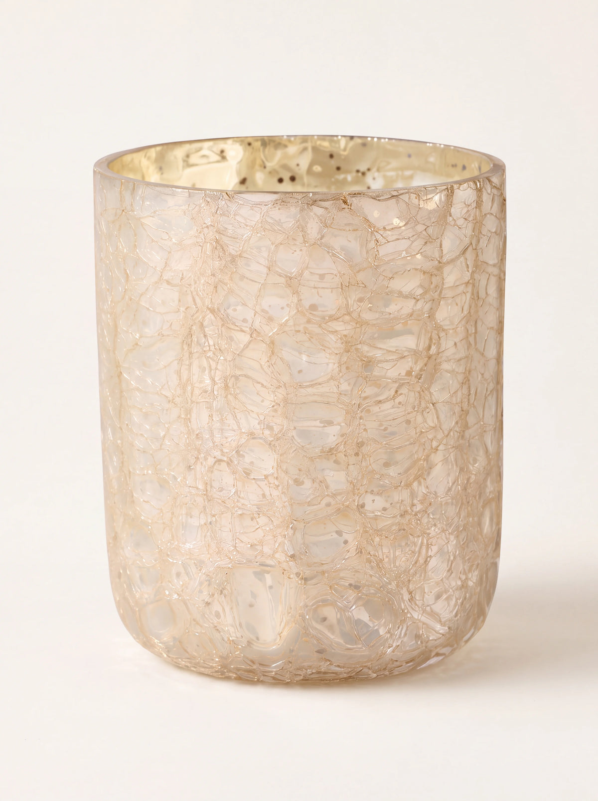 Scented candle in a cylindrical gold crackle glass vessel with a textured finish