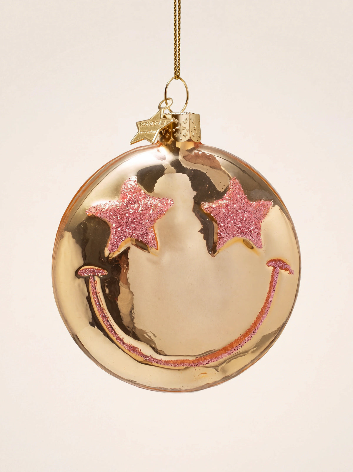Gold glass smiley ornament with a mirror finish, pink glitter star eyes and a smile
