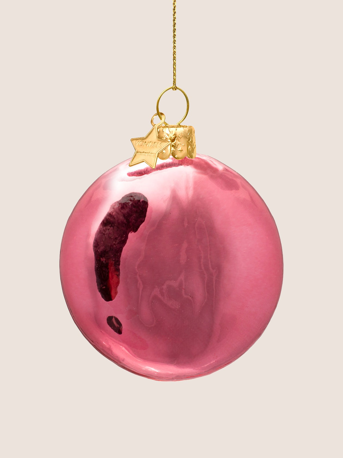 Reverse side of the pink glass ornament showing the plain shiny surface
