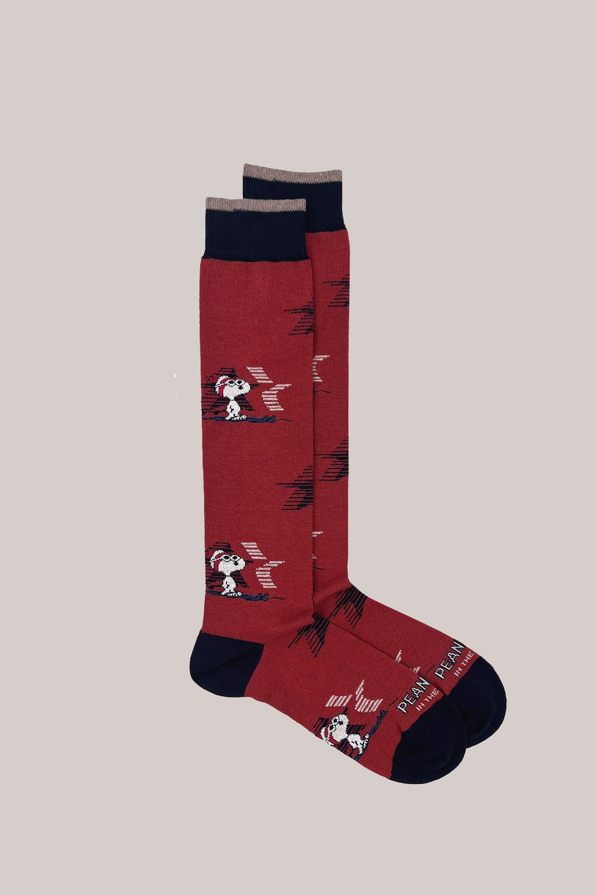 Bordeaux knee-high ski socks with skiing Snoopy pattern, contrasting navy blue cuffs, heels and toes
