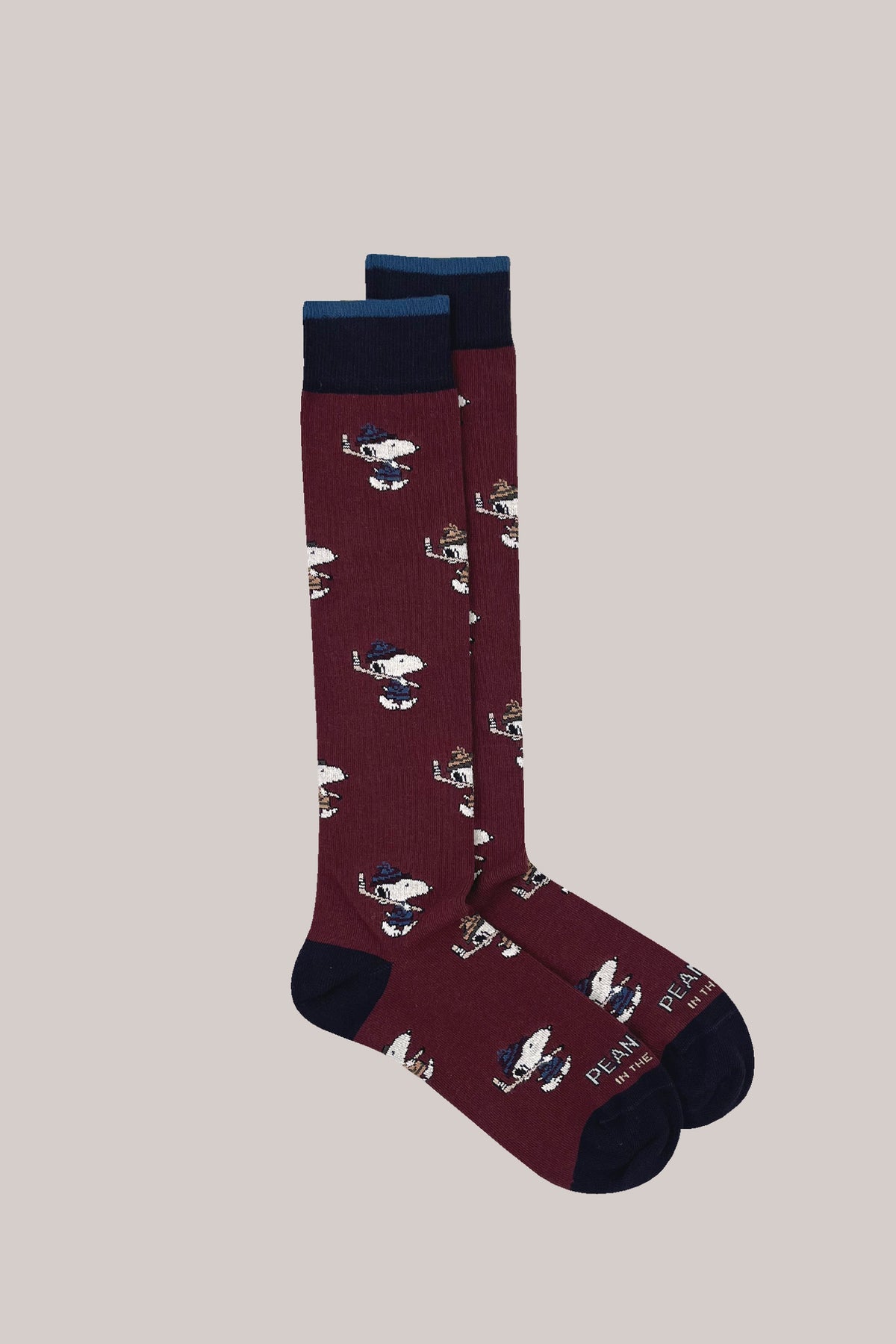 Bordeaux knitted socks with Snoopy hockey motif, navy ribbed cuffs with a blue stripe, and contrast heels and toes