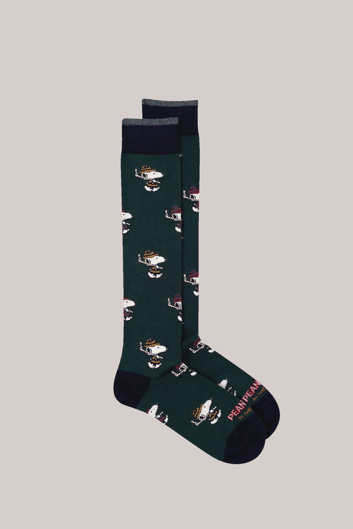 Dark green socks with all-over Snoopy hockey motifs, contrasting navy cuffs, heels and toes