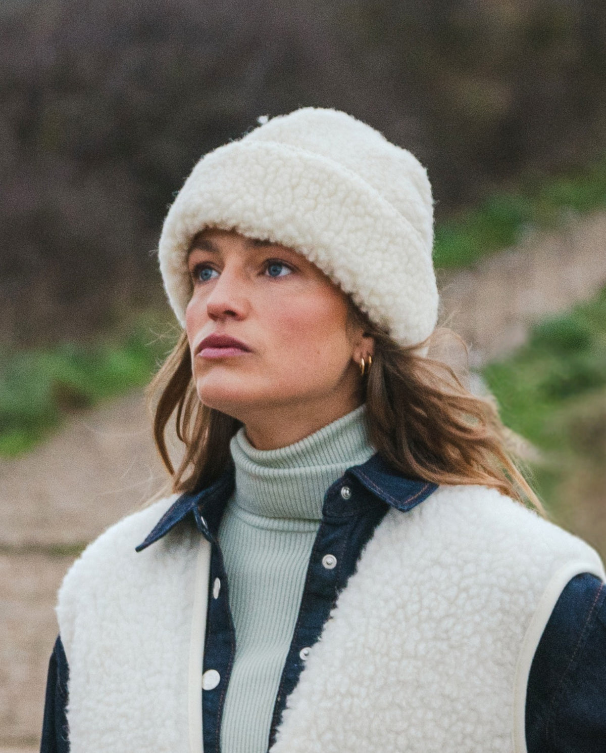 Natural white sheep wool beanie with a textured fleece finish and wide turned-up cuff