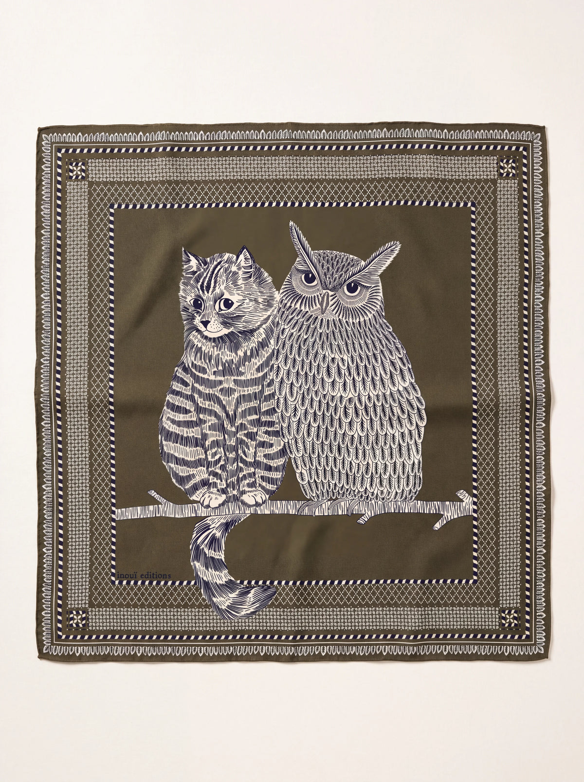 Square khaki wool scarf featuring an illustrated cat and owl perched on a branch, with patterned borders