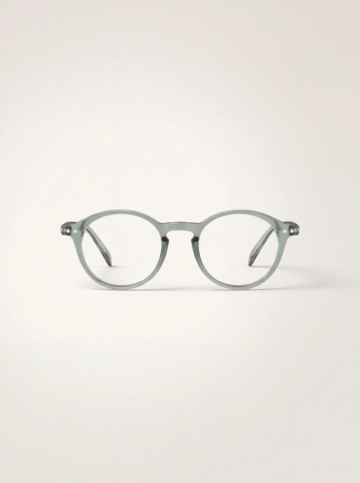 Round reading glasses with a translucent pale green frame and keyhole bridge