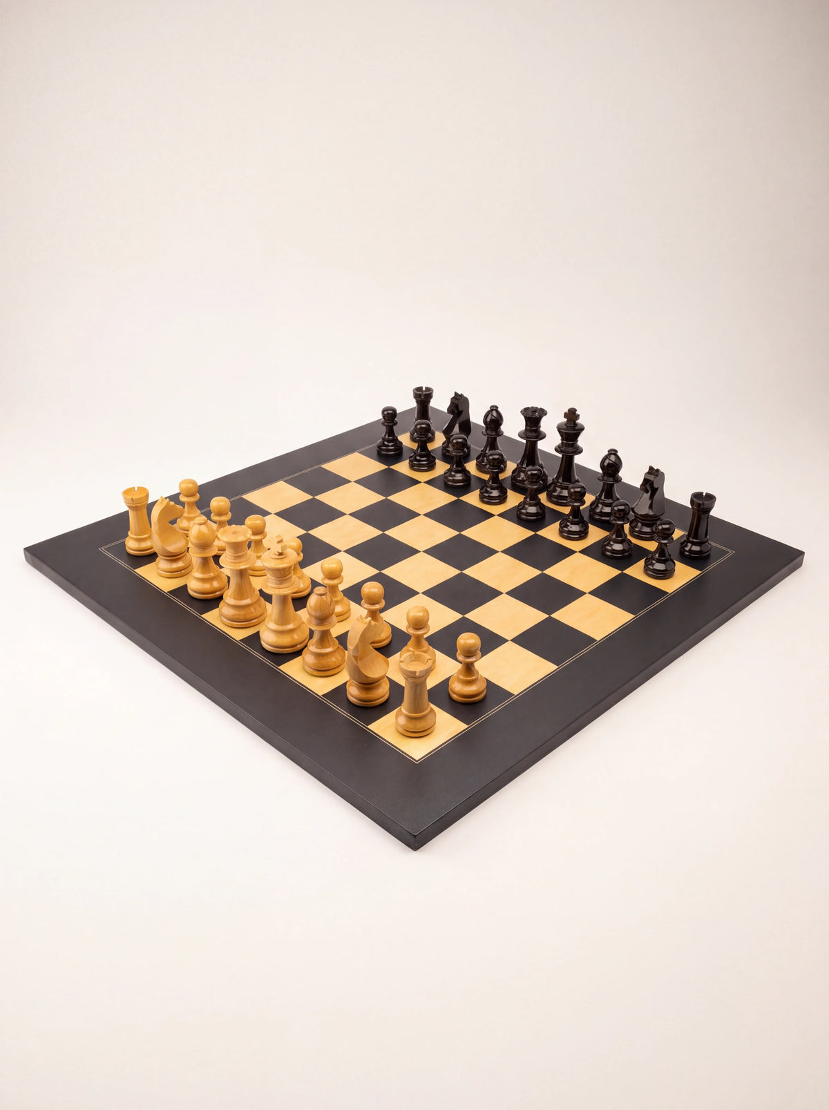 Angled view of the wooden chess set displaying the full checkered board and piece setup