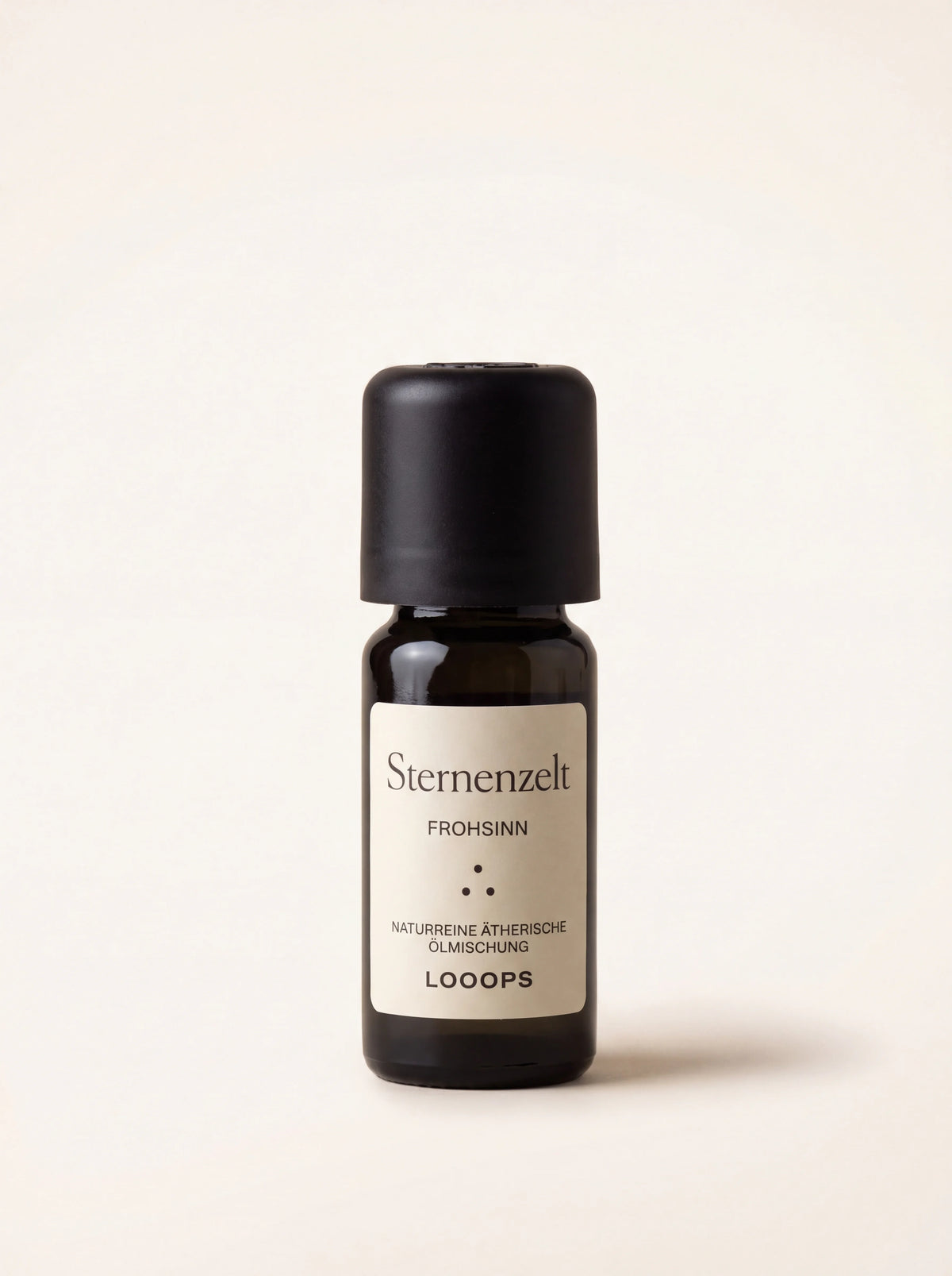 Amber glass essential oil bottle with a black cap and label reading Sternenzelt Frohsinn Looops