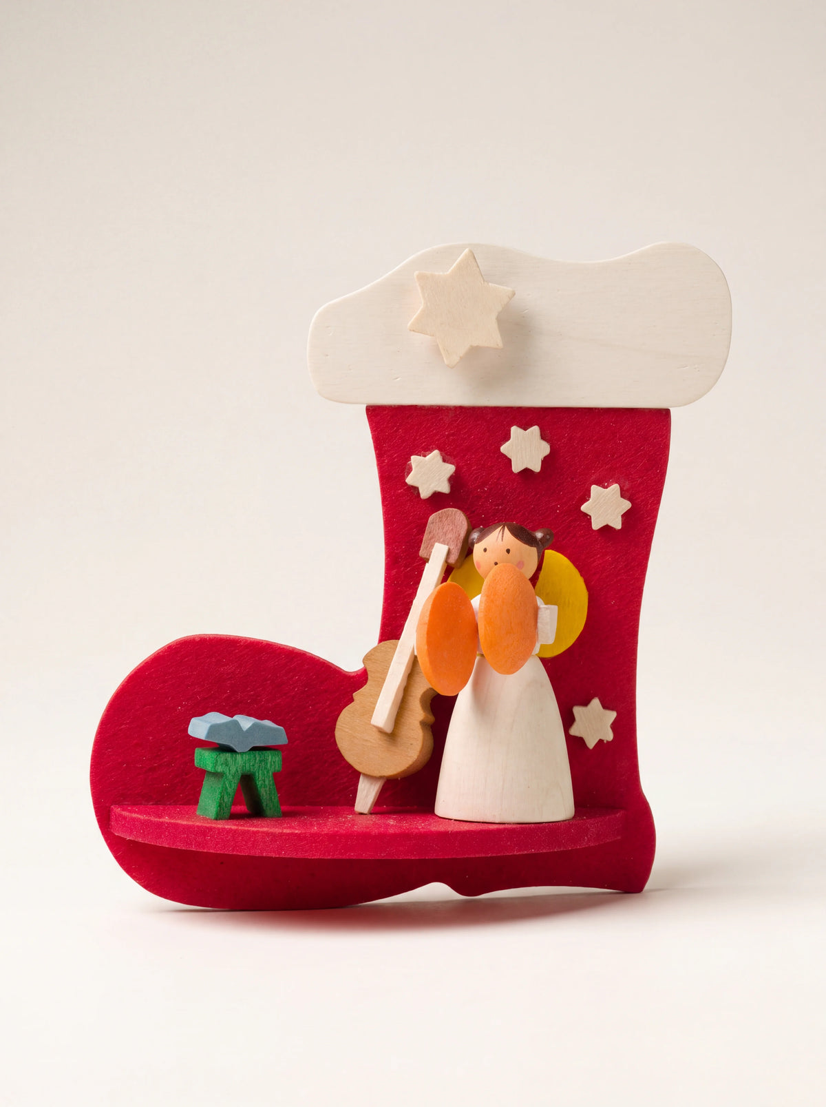 Wooden stocking ornament in red with a painted angel figurine, miniature cello and music stand