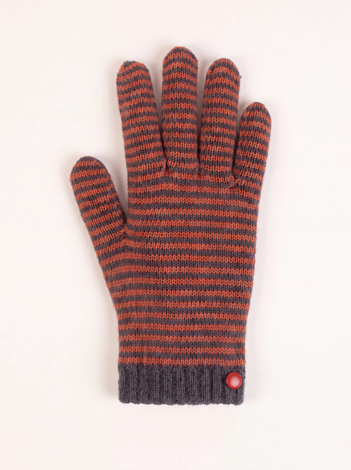 Knitted wool and cashmere glove with grey and rust-orange stripes, ribbed cuff, and a small red button