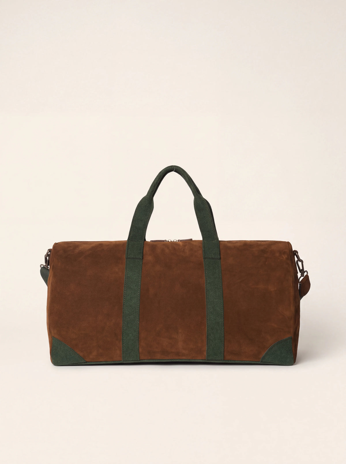 Brown suede duffle bag with dark green felt handles and reinforced corners