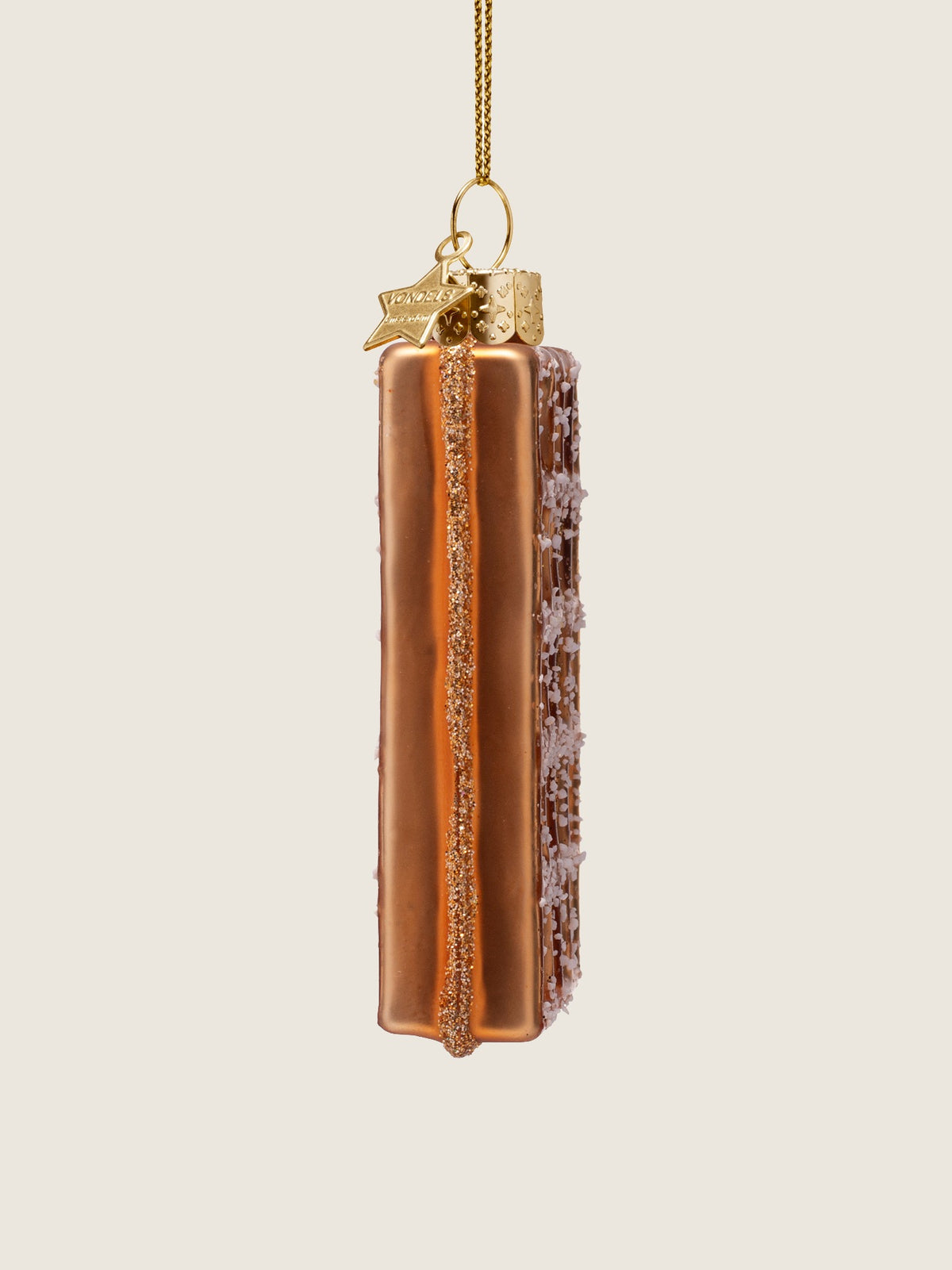 Side view showing the thickness and smooth golden surface accented with a central glitter stripe