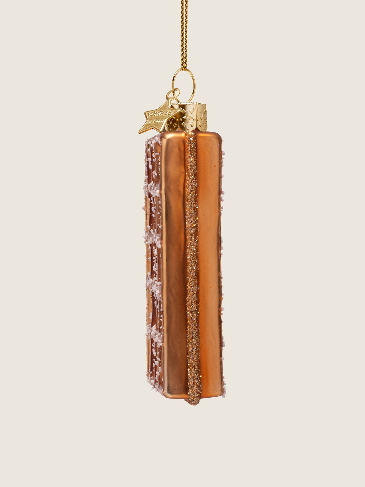 Opposite side profile showing the depth of the ornament and the glitter strip along its seam