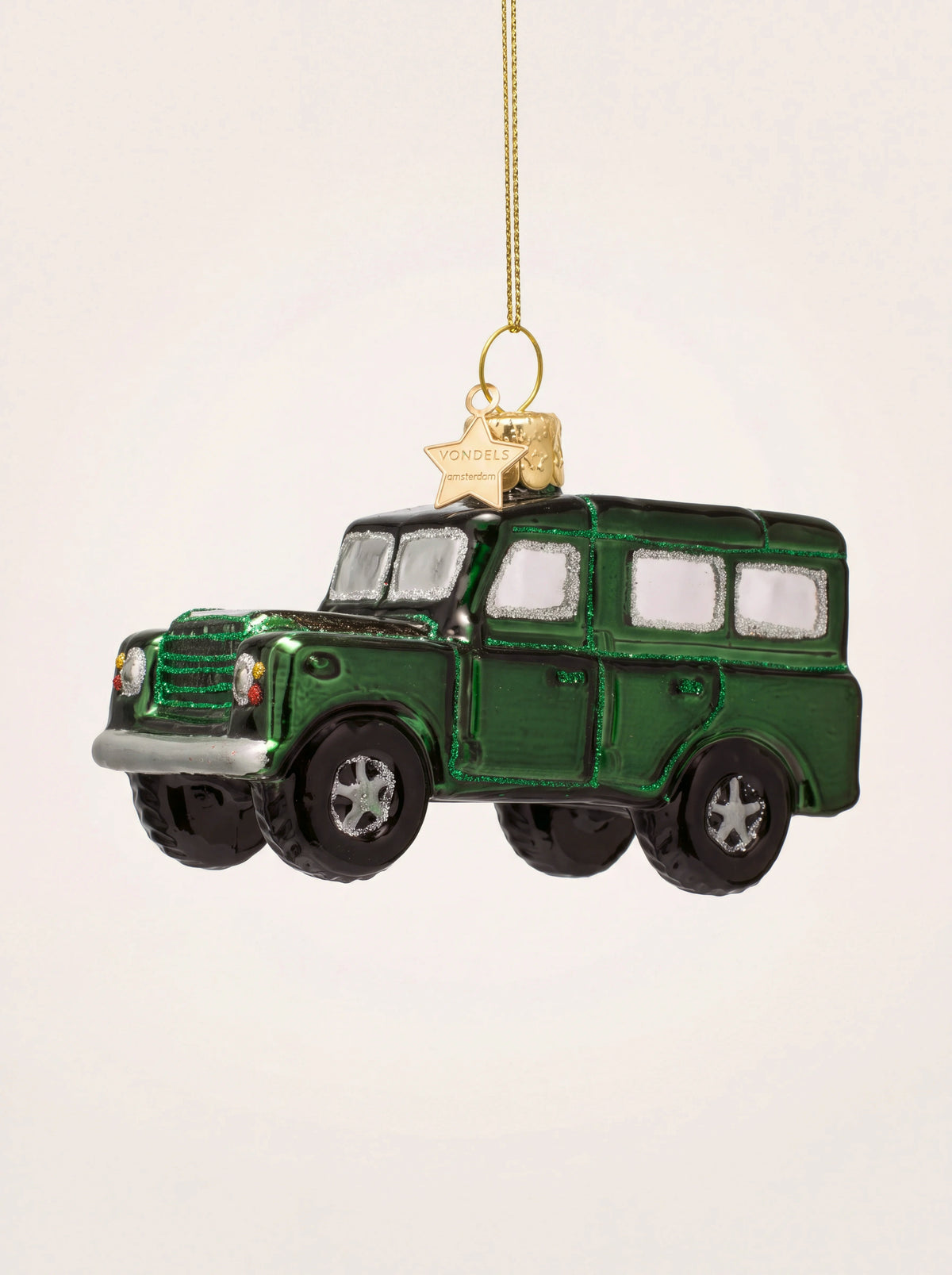 Dark green glass SUV ornament with silver-trimmed windows, front grille and a gold hanging loop