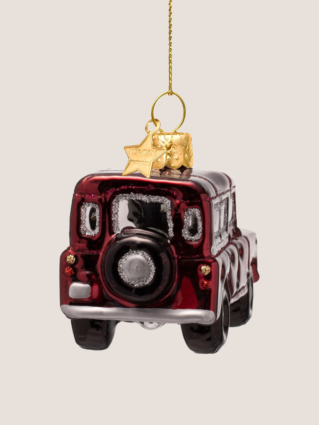 Rear view of the glass SUV ornament showing the mounted spare wheel with silver glitter detailing