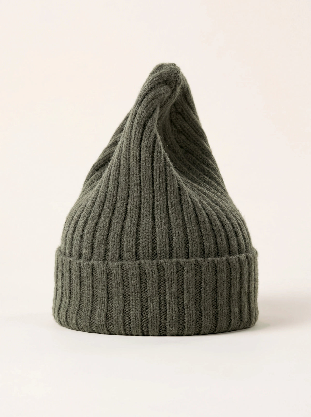 Tall ribbed wool beanie in dark olive green with a wide folded cuff