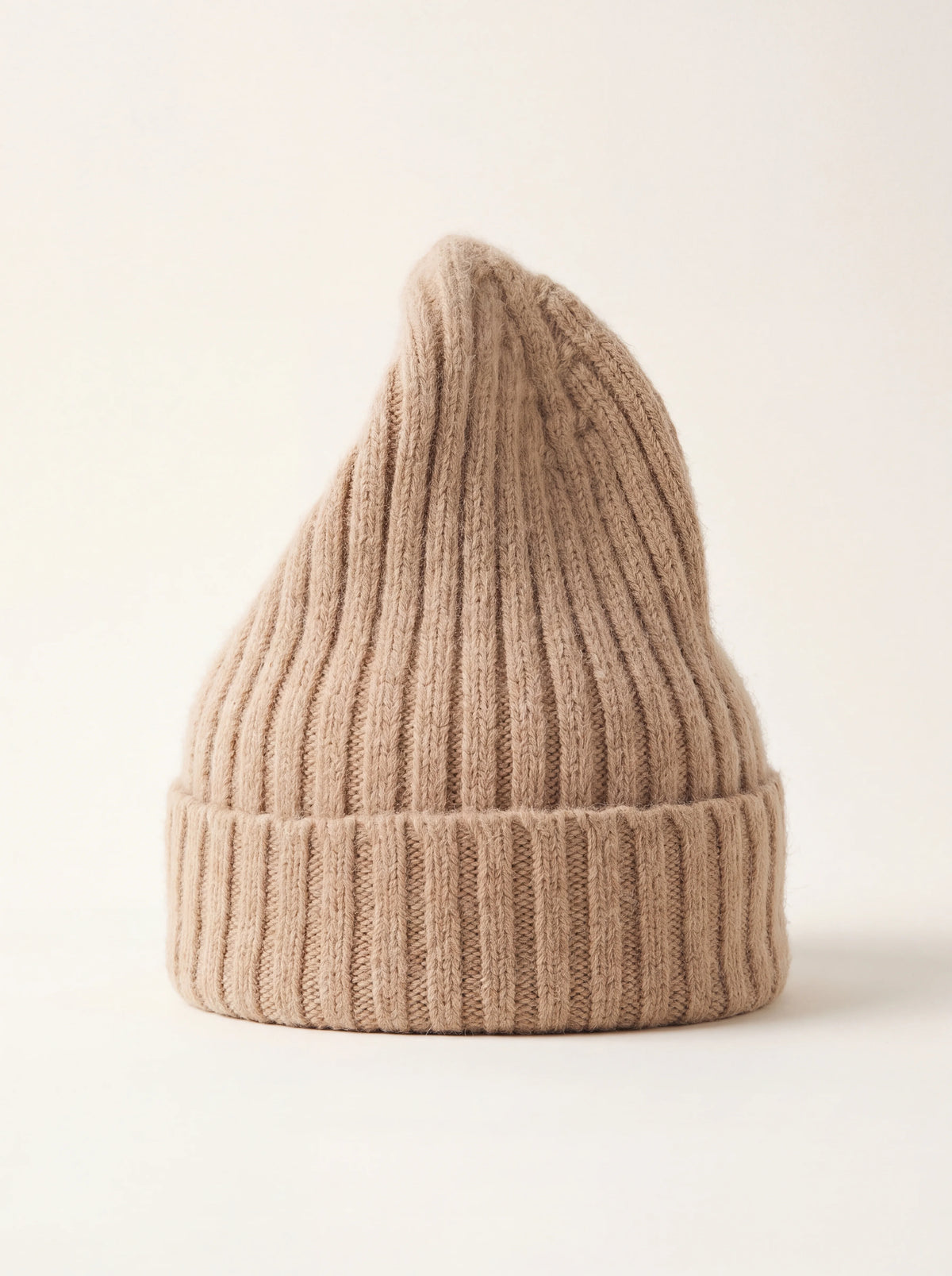 Sand ribbed wool beanie with a tall crown and wide folded cuff
