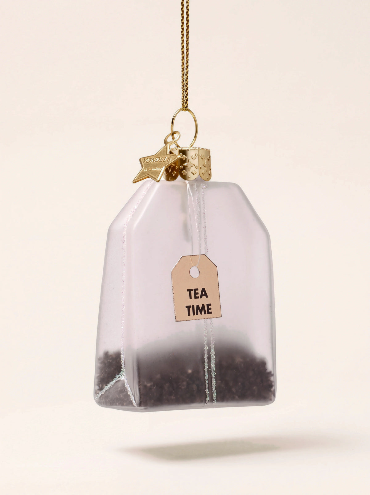 Frosted glass tea bag ornament with glitter detailing and a tag reading TEA TIME