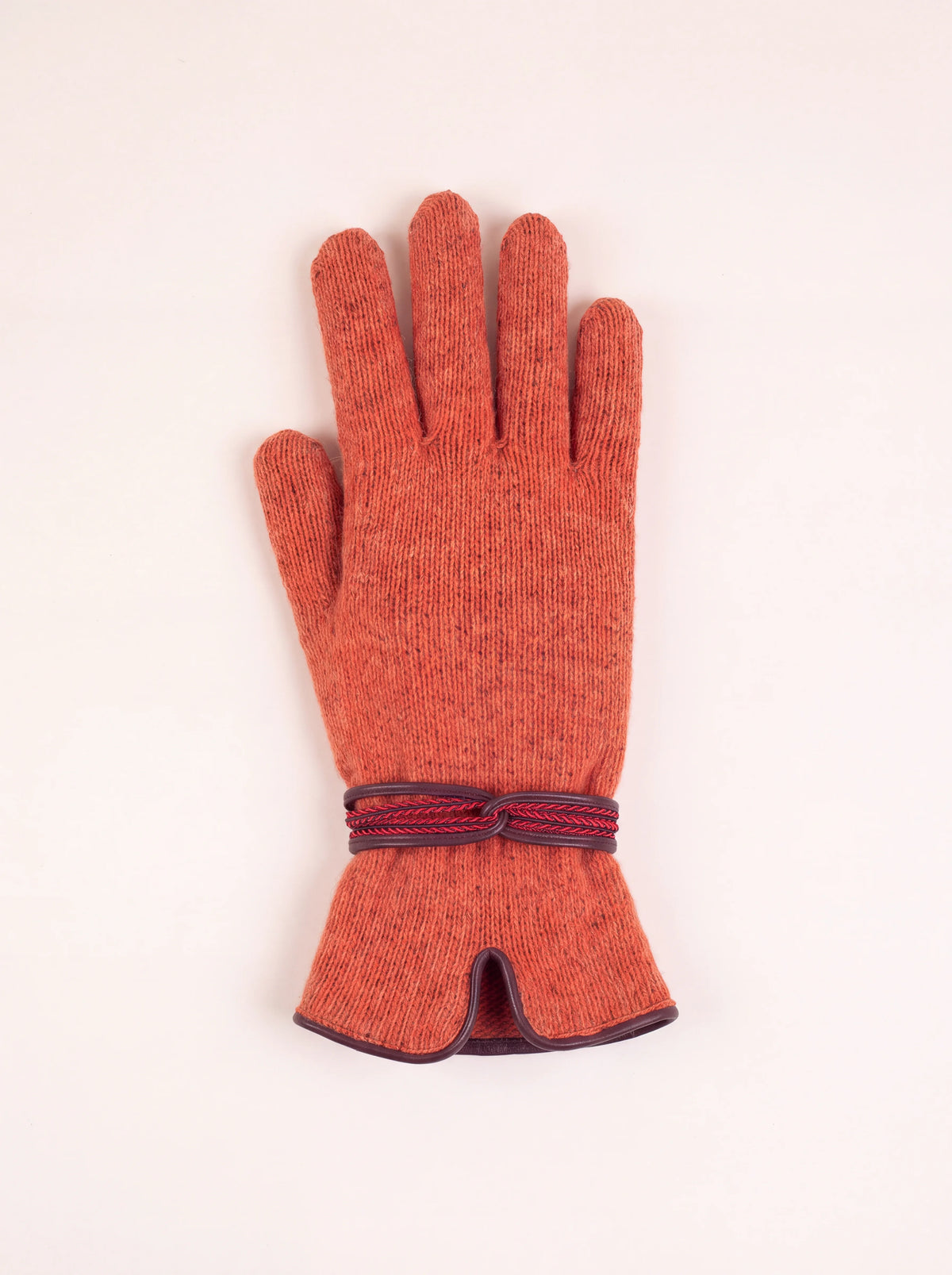 Terracotta knitted wool-blend glove with a decorative wrist strap and notched trimmed cuff