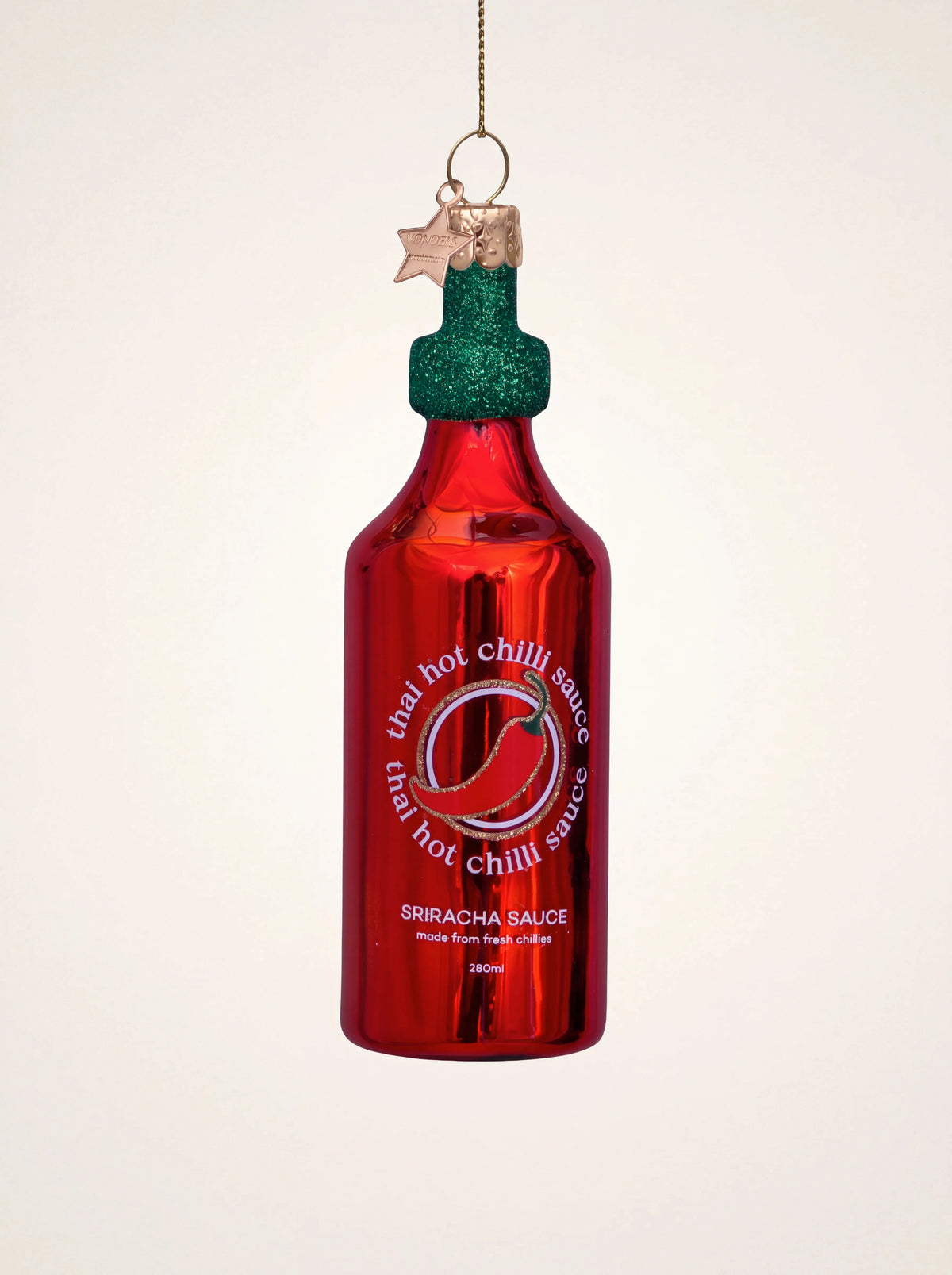 Thai chilli sauce glass bottle ornament in glossy red with a green glitter cap and painted label