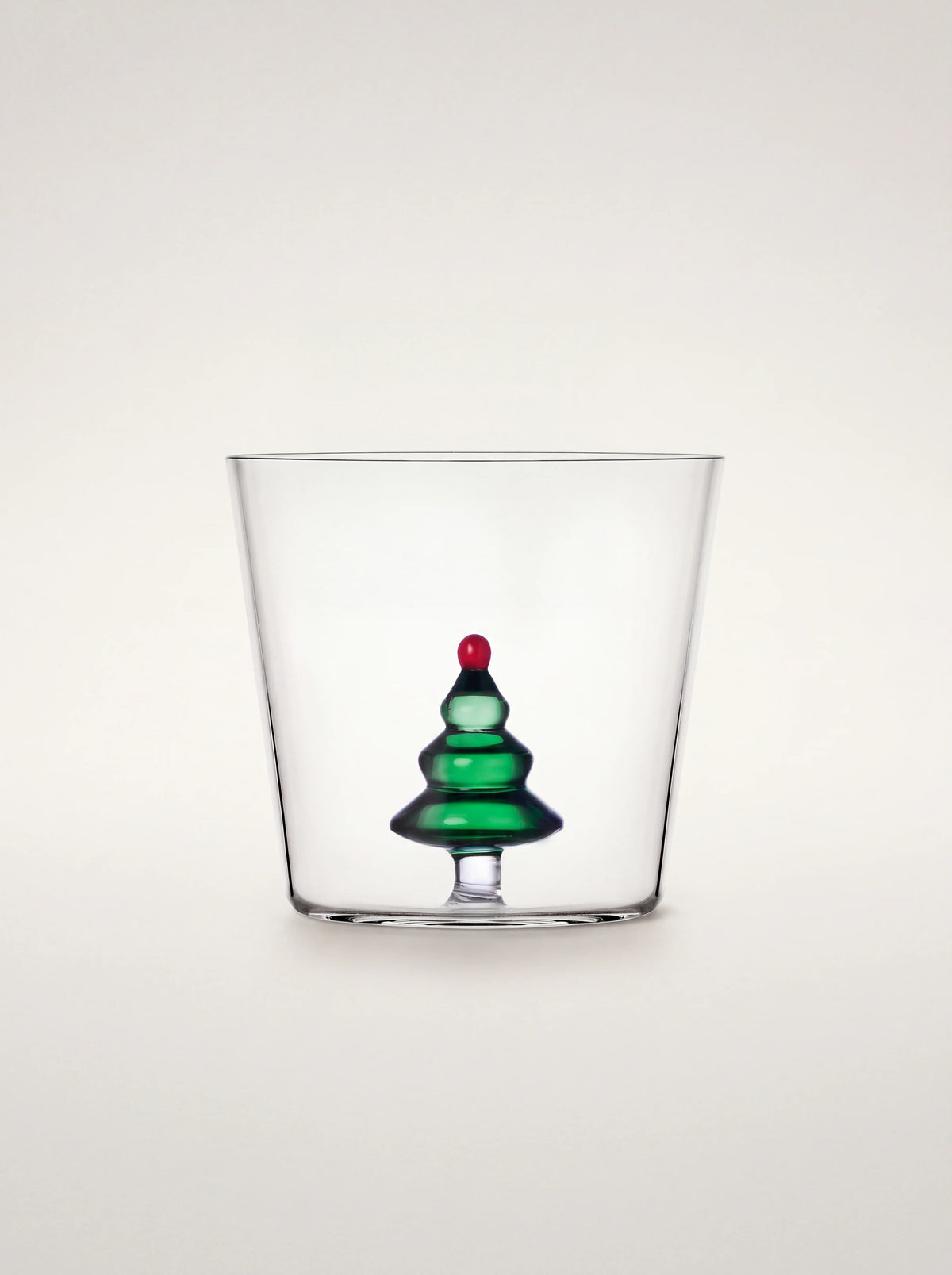 Clear borosilicate glass tumbler with an integrated green tiered Christmas tree topped with a red sphere