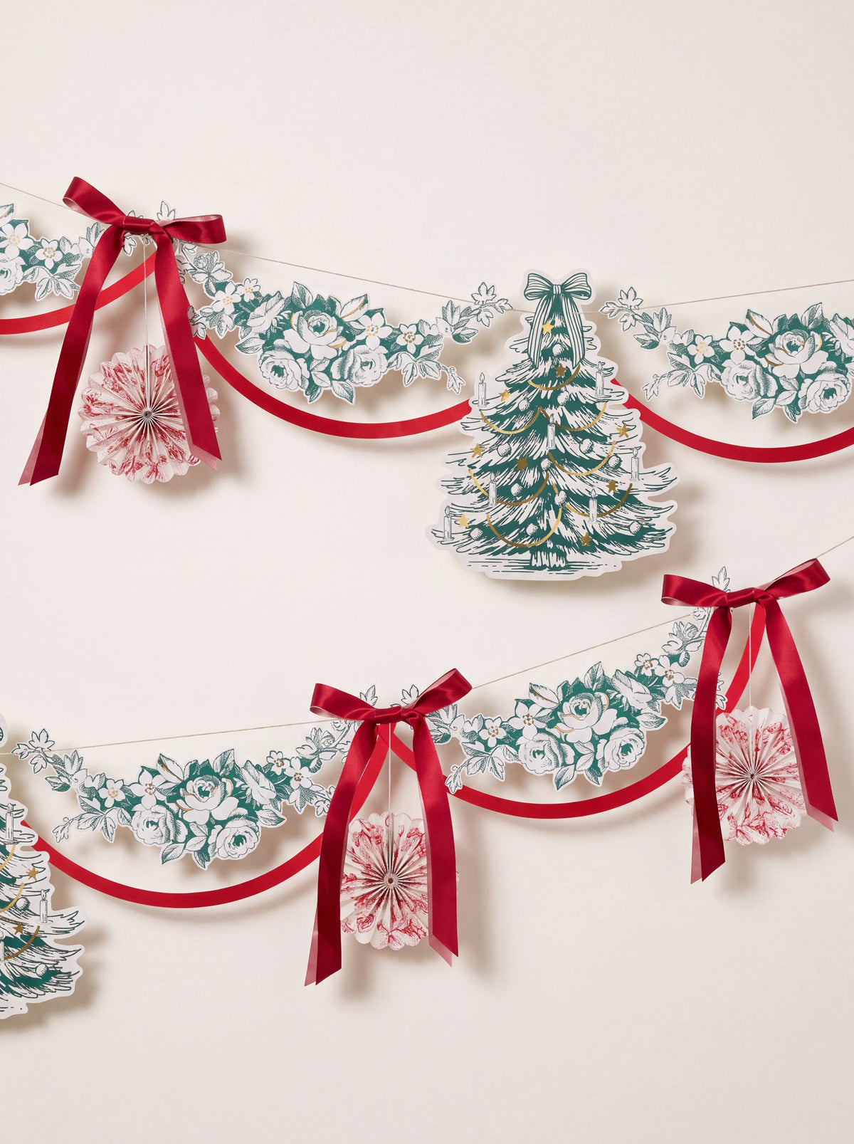 Toile de Jouy Christmas garland with green paper foliage, Christmas trees, red satin bows and pinwheels