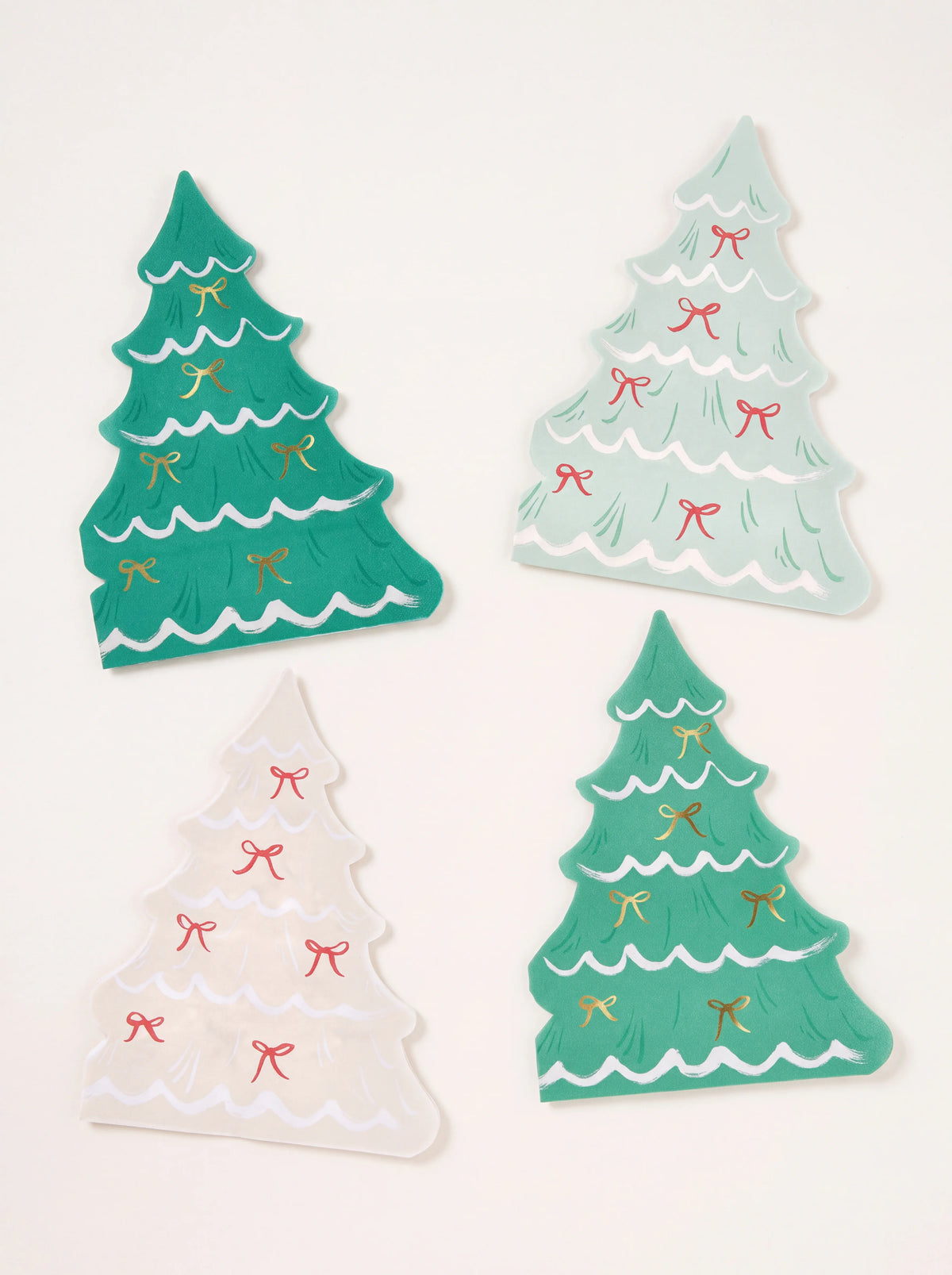Tree-shaped paper napkins in dark green, green, mint and cream with bow motifs and scalloped edges