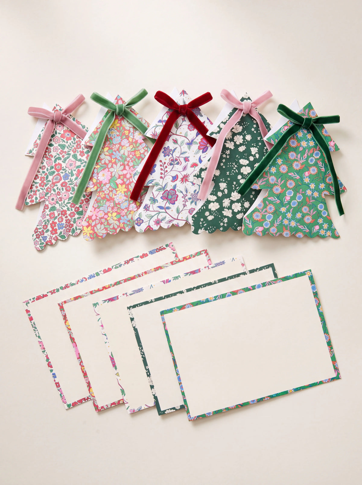Tree-shaped floral Christmas cards with velvet ribbon bows, shown with matching patterned envelopes
