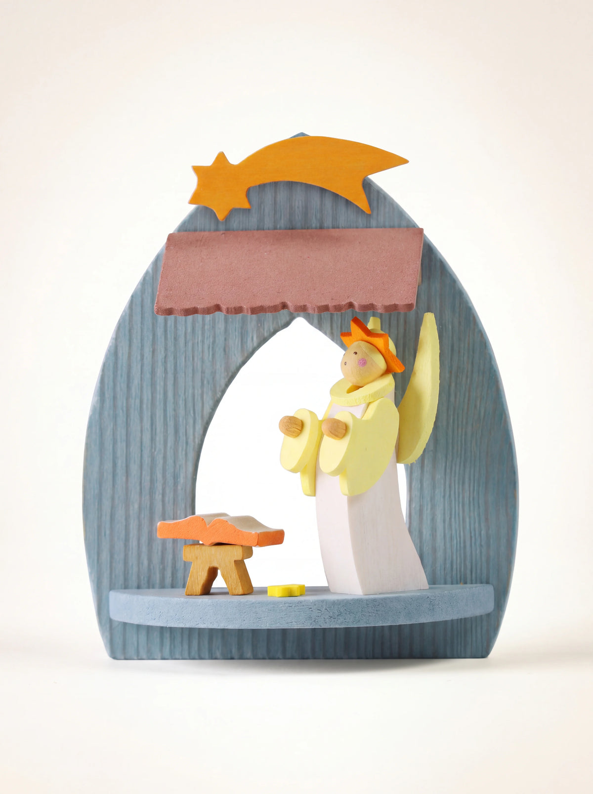 Maple wood tree ornament with an arched blue frame, angel figurine, open book and shooting star
