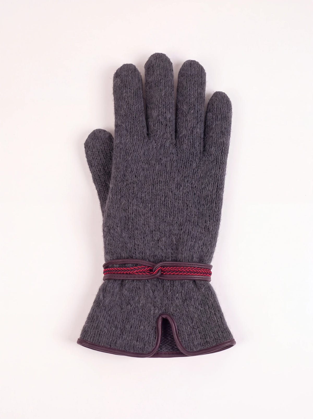 Grey knitted wool and cashmere glove with a decorative braided wristband and piped slit cuff