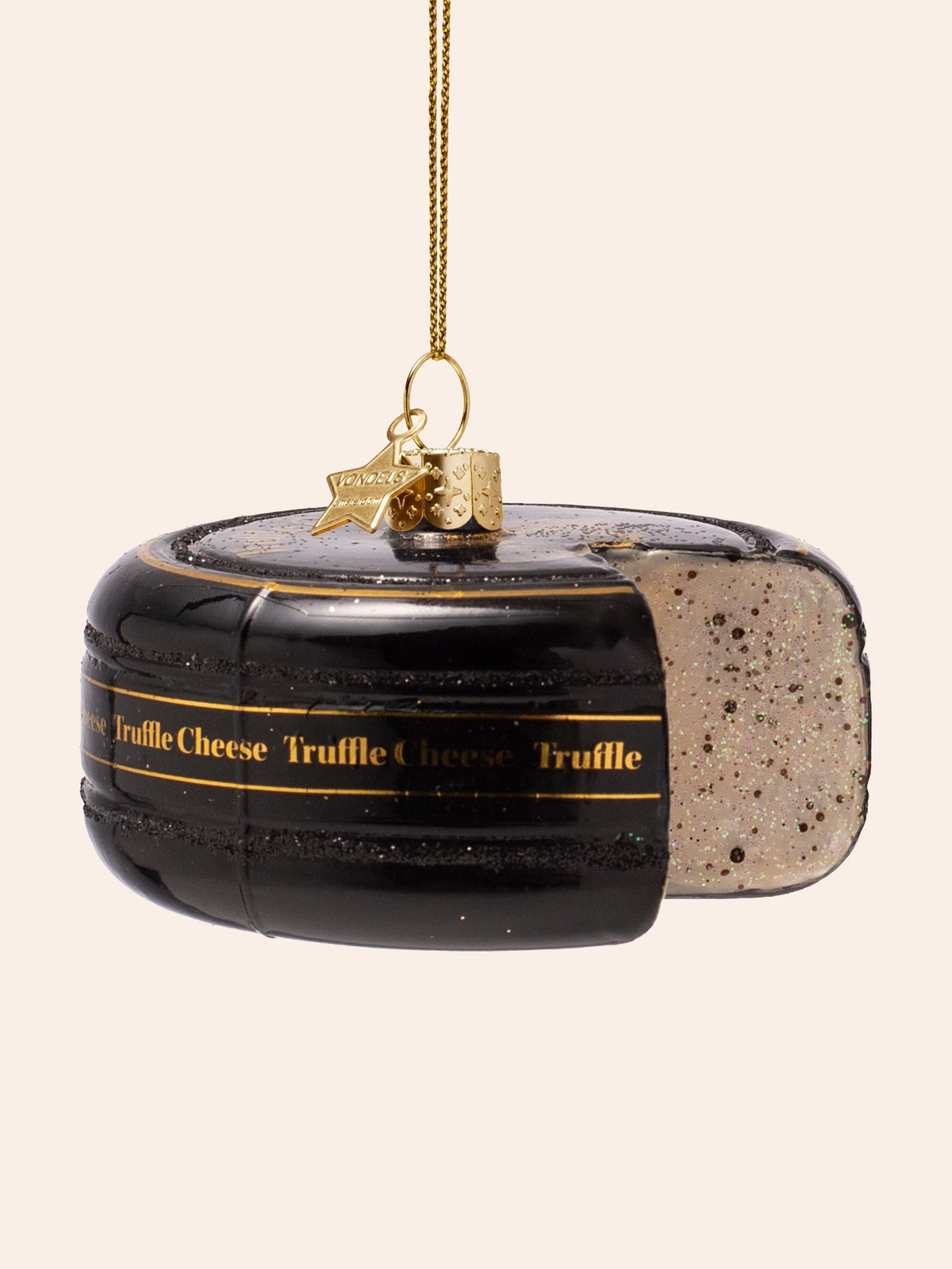 Angled view showing the gold lettering on the black rind and the cut-out section to the right