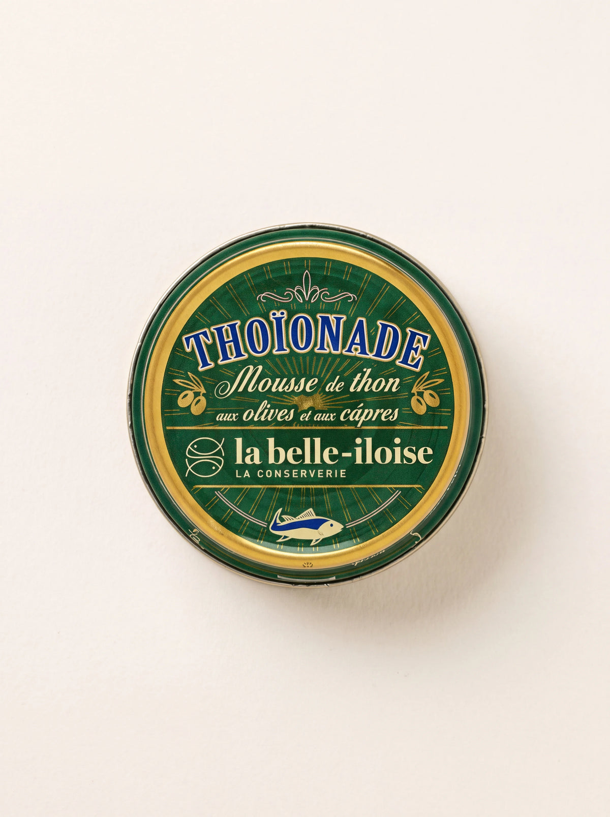 Tuna mousse in a round green and gold tin labelled Thoïonade, Mousse de thon aux olives et aux câpres