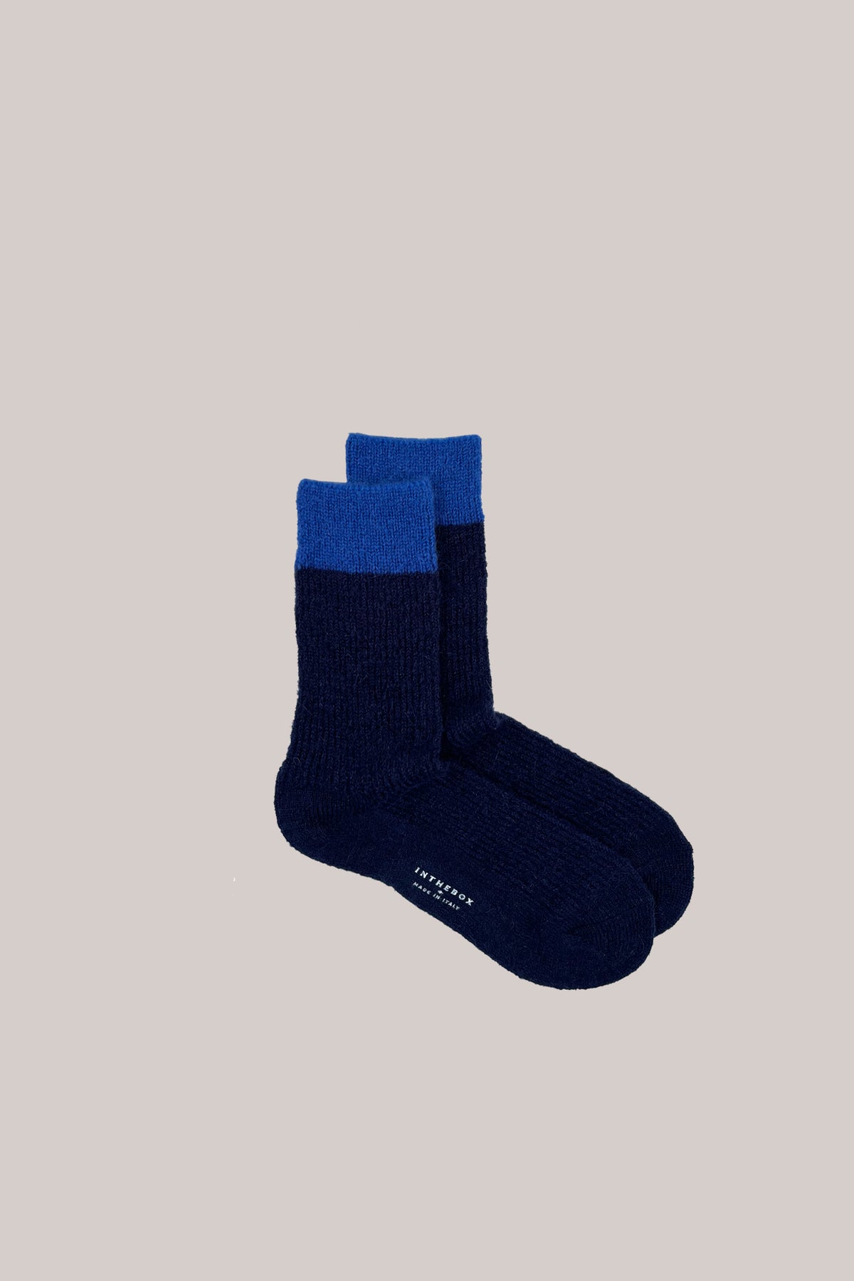 Two-tone knitted mohair socks in dark blue with bright blue cuffs and INTHEBOX MADE IN ITALY on the sole