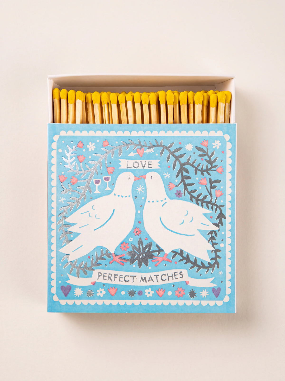 Square matchbox with yellow-tipped matches, showing two white doves and banners reading Love and Perfect Matches