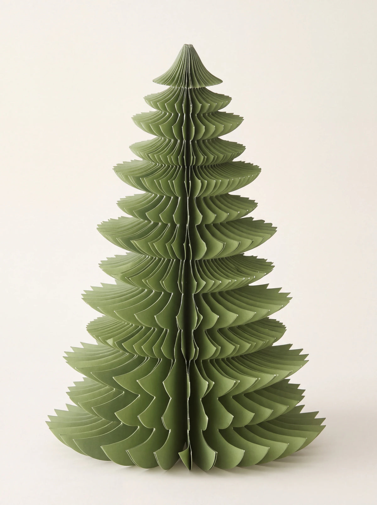 Tiered honeycomb paper tree decoration in forest green with serrated edges