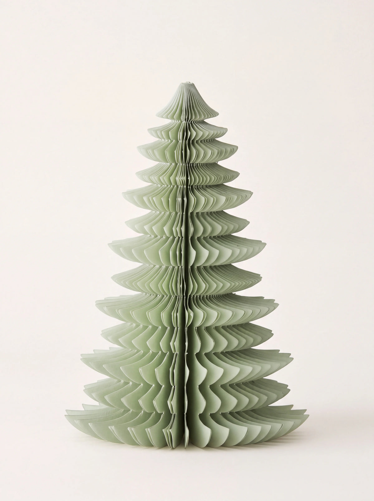 Freestanding paper tree in pale sage green with a tiered honeycomb design