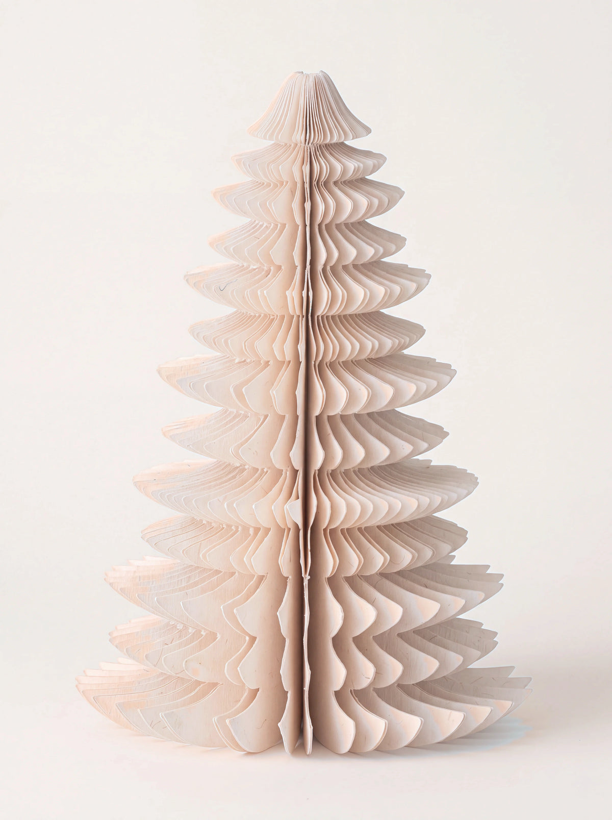 Free-standing tiered honeycomb paper tree decoration in powder pink