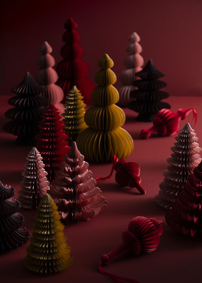 Ruby paper tree displayed among honeycomb trees and hanging decorations in varied tones