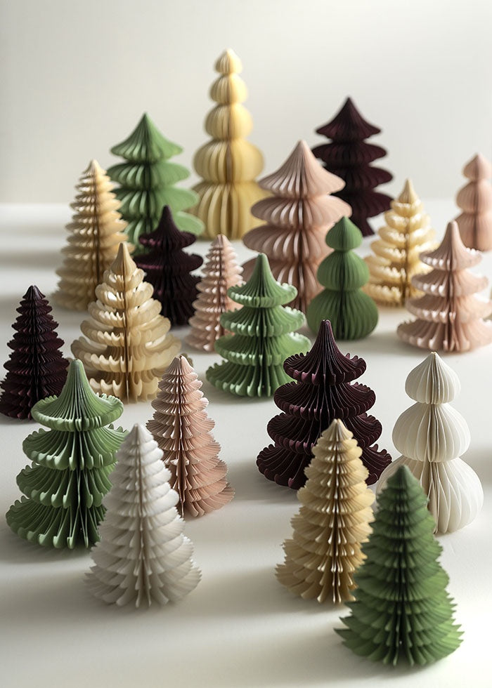 Arrangement of paper honeycomb Christmas trees in varied sizes, silhouettes and muted colours