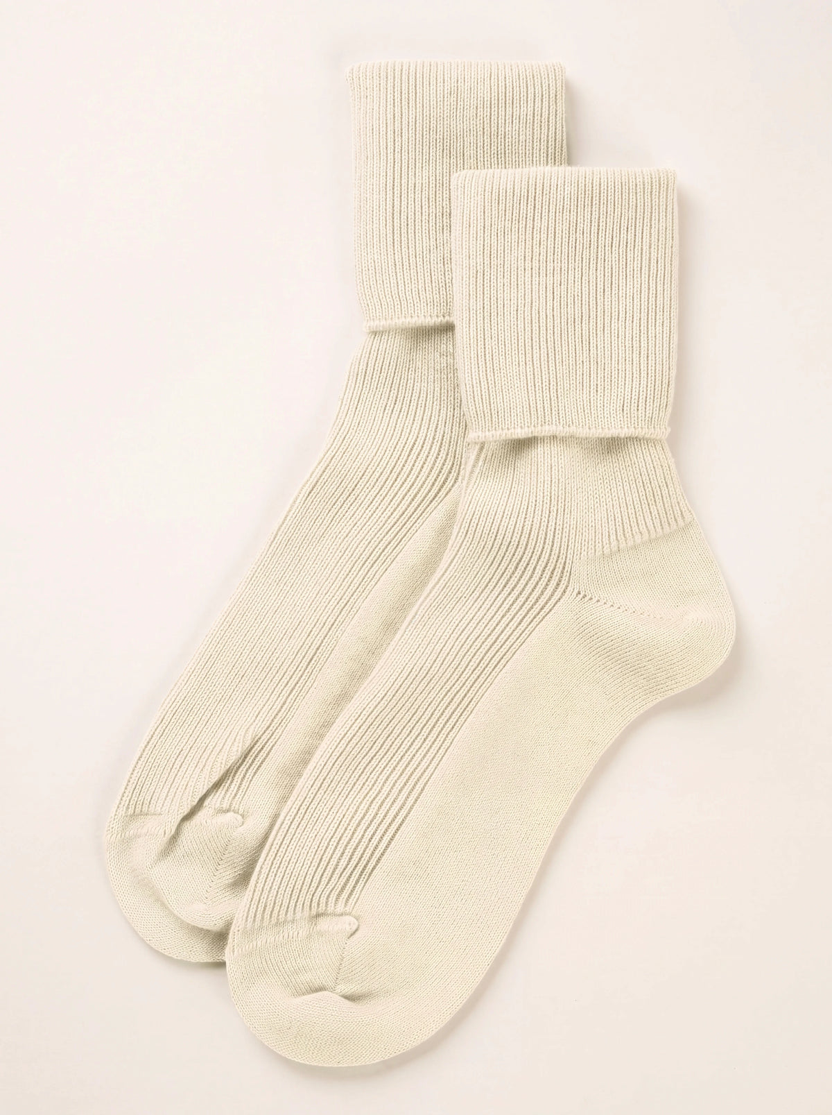 Pair of champagne ribbed cashmere ankle socks with folded cuffs