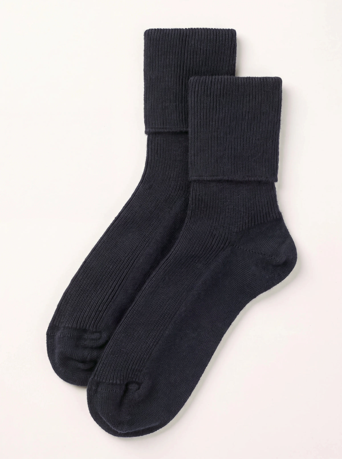 Dark navy ribbed cashmere ankle socks with fold-over cuffs, laid flat as a pair