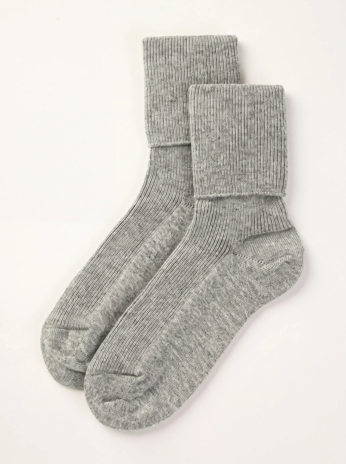 Light grey ribbed cashmere ankle socks with fold-over cuffs, laid flat as a pair