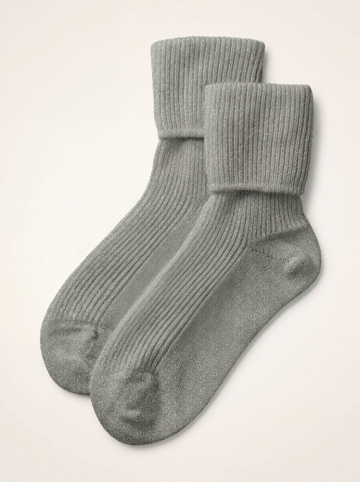 Light grey ribbed cashmere travel socks with folded-over cuffs, laid flat