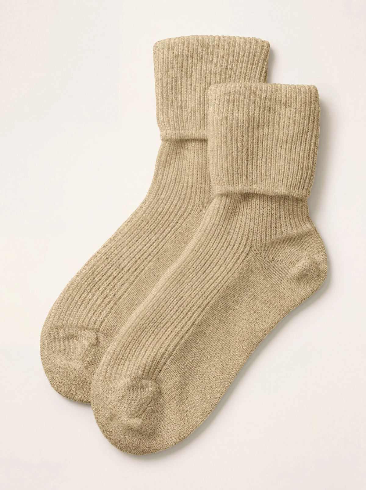 Pair of oatmeal ribbed cashmere travel socks with fold-over cuffs