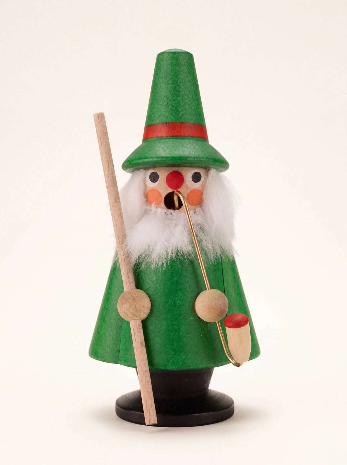 Green wooden gnome incense smoker with a pointed hat, white beard, pipe and walking stick