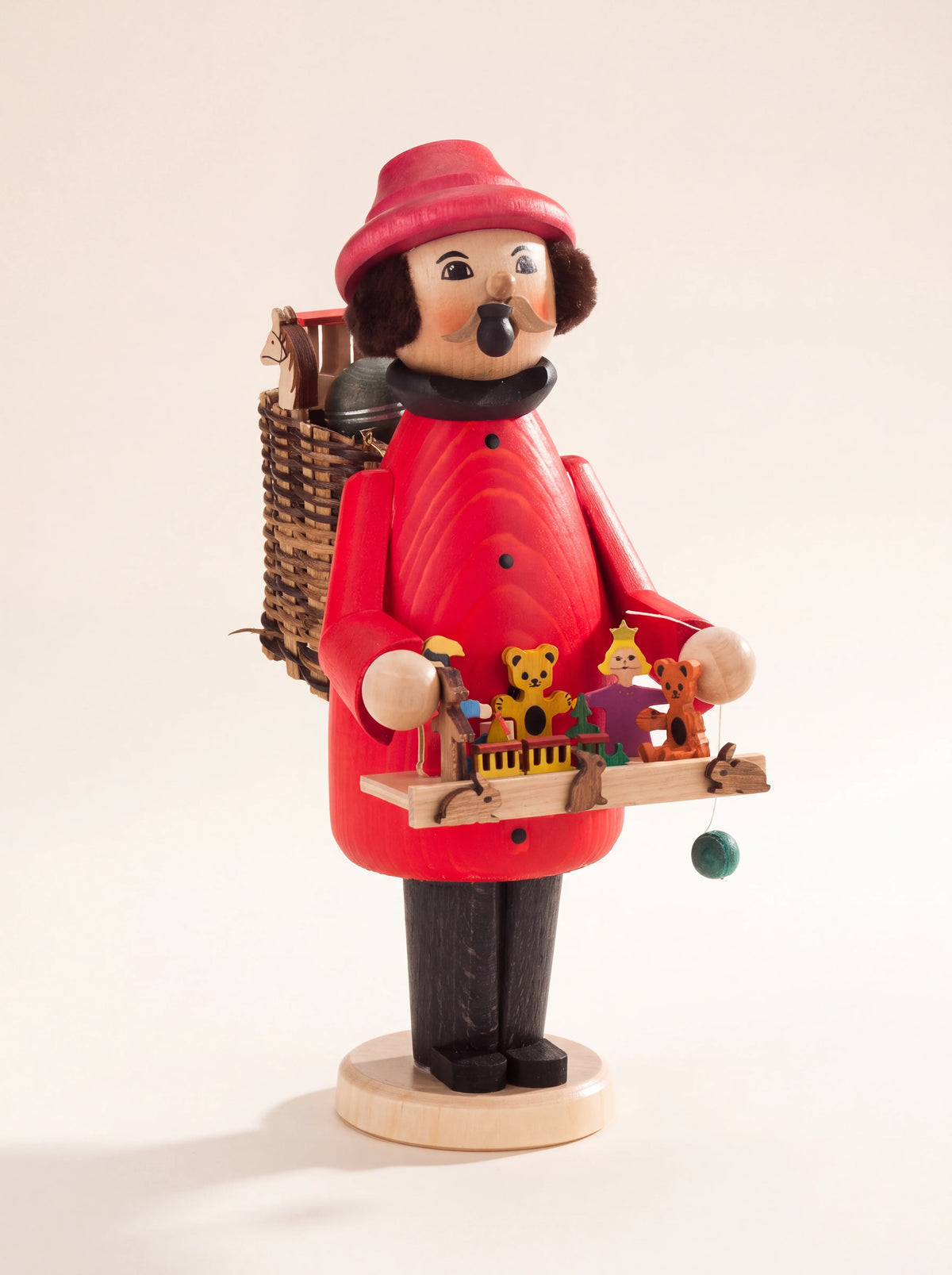 Wooden incense smoker toy seller in a red coat, carrying a woven basket and a tray of miniature toys