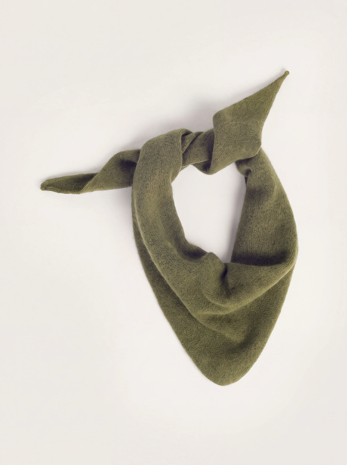 Olive green knitted wool bandana tied loosely with tapered ends