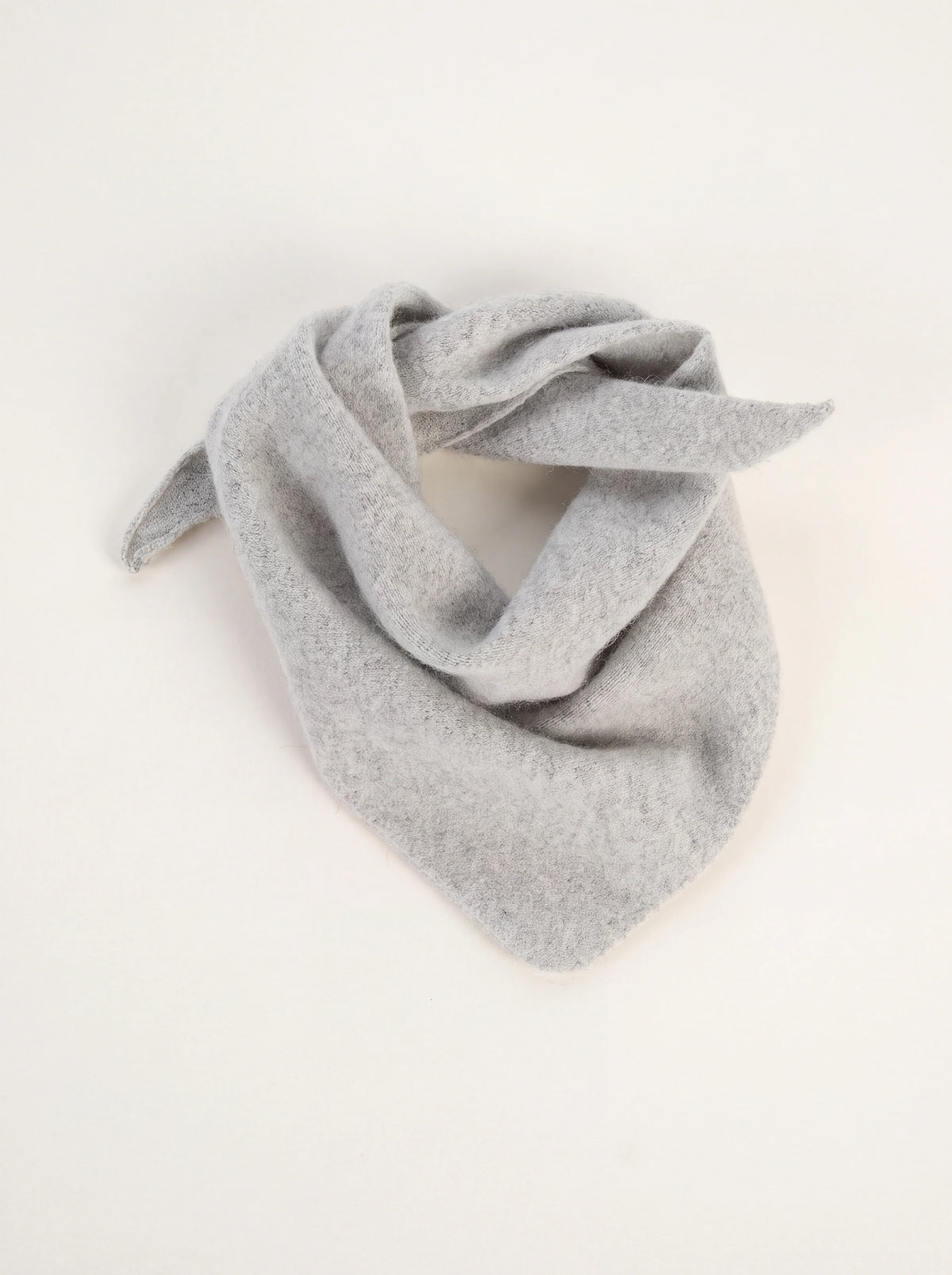 Silver grey knitted wool bandana draped in a triangular fold with tapered ends